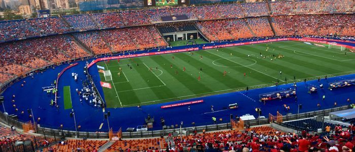 Watching Football Game in Action at Olympic standard sports facilities