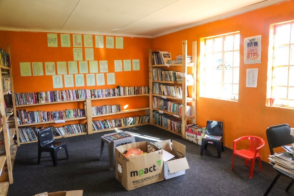 Brushing strokes of change! Members of the Travelwings team lend their creativity to revitalize the arts center, infusing colors of hope and inspiration into the community.