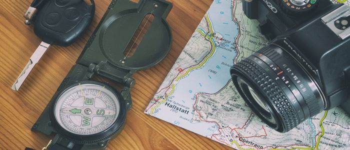 travel-map-car-key-compass-and-camera.jpg